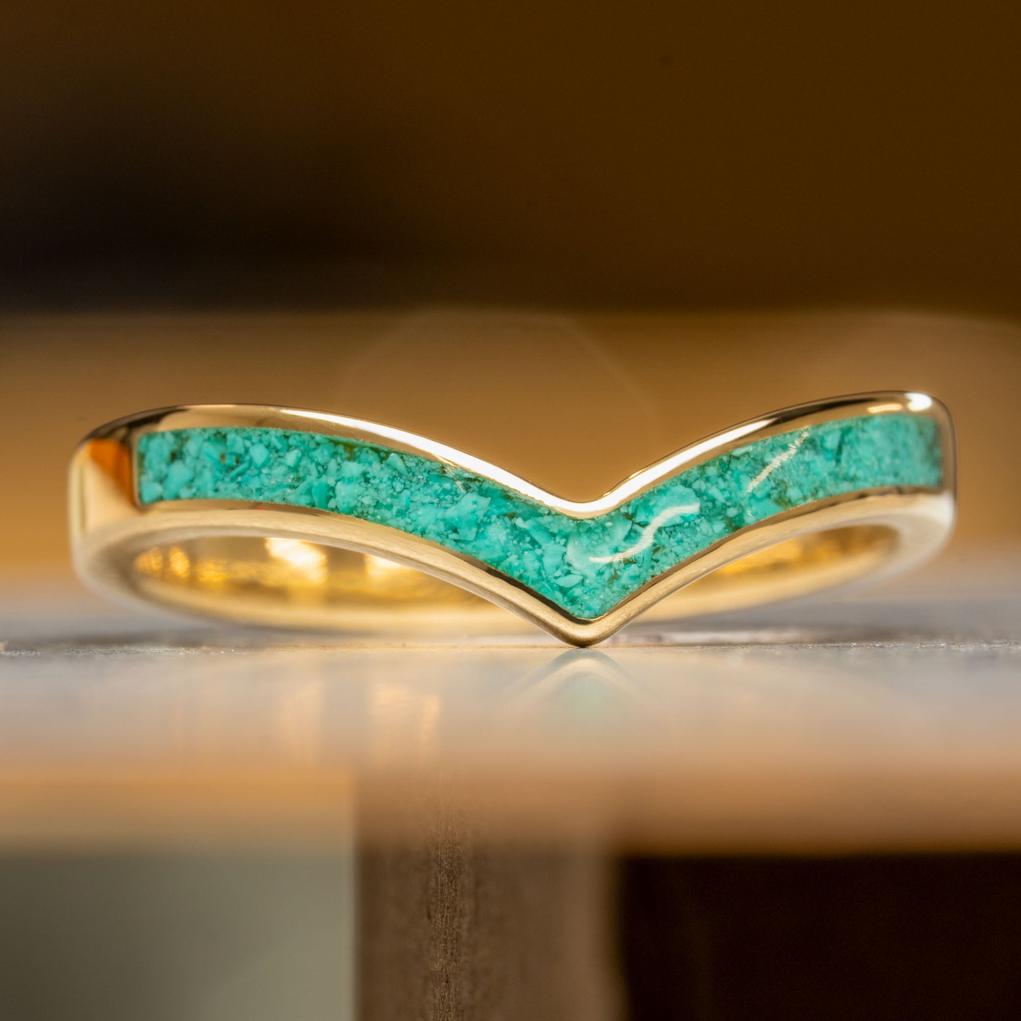 Gold ring deals with turquoise inlay