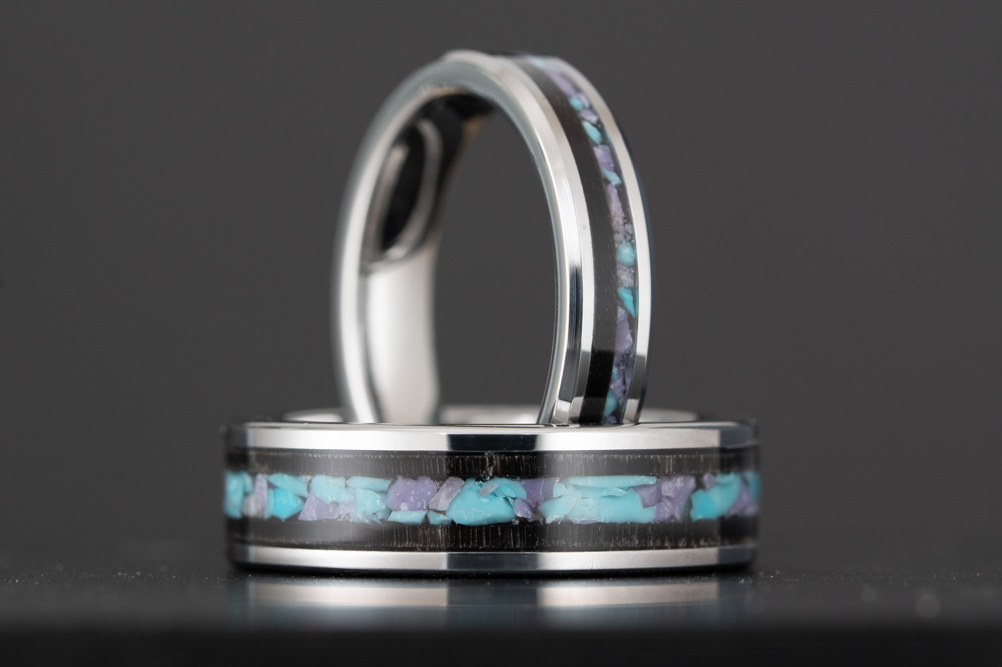 Matching custom titanium wedding band set with turquoise, amethyst, and dark wood inlay, handcrafted in Colorado by Honest Hands Ring Co.