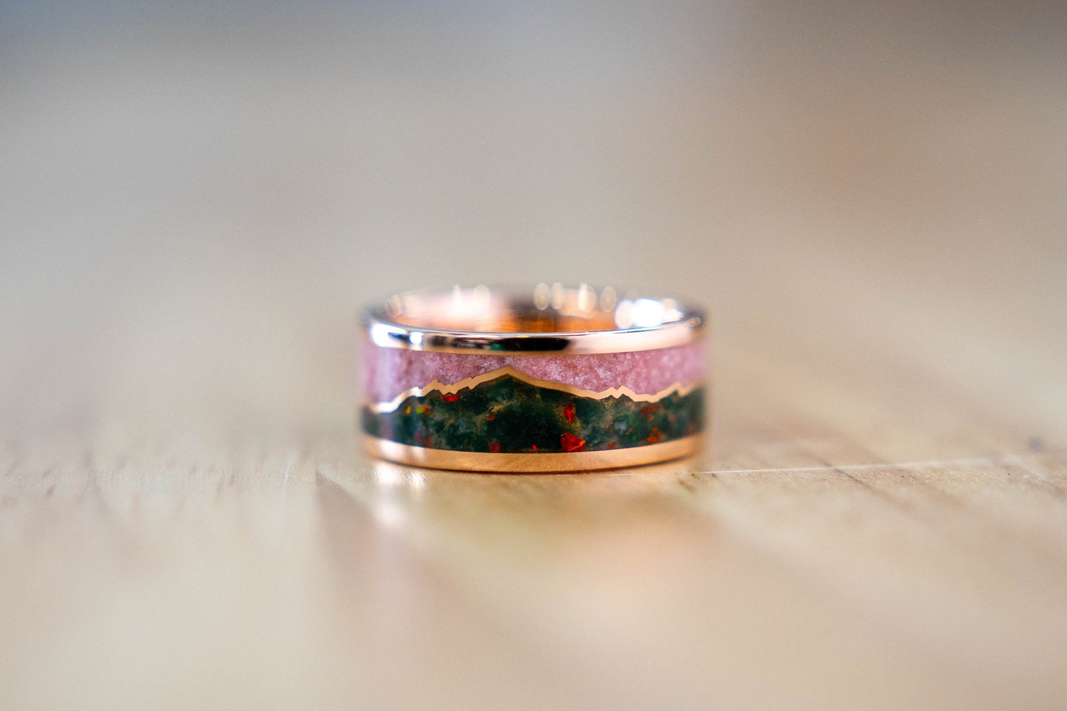 Finished custom 18k rose gold band with moss agate and pale pink morganite inlay representing Hatcher Pass