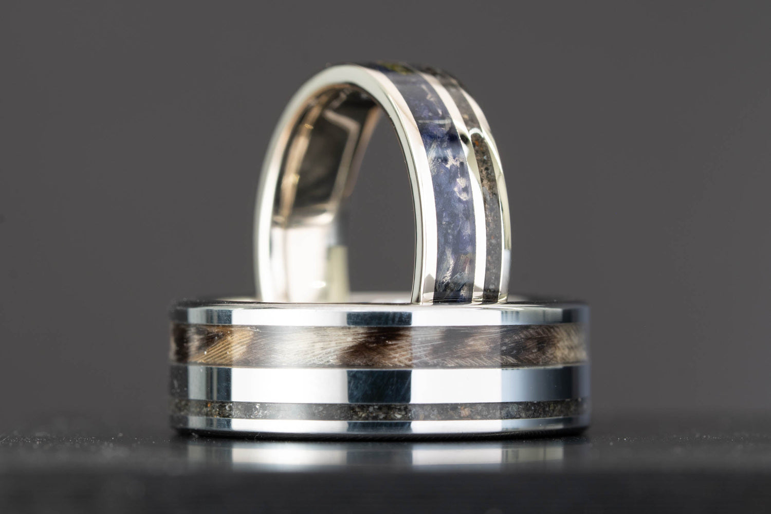 Custom 14k white gold and tungsten engagement ring set with lupine petal, owl feather, and glacier sand inlay, handcrafted by Honest Hands Ring Co.