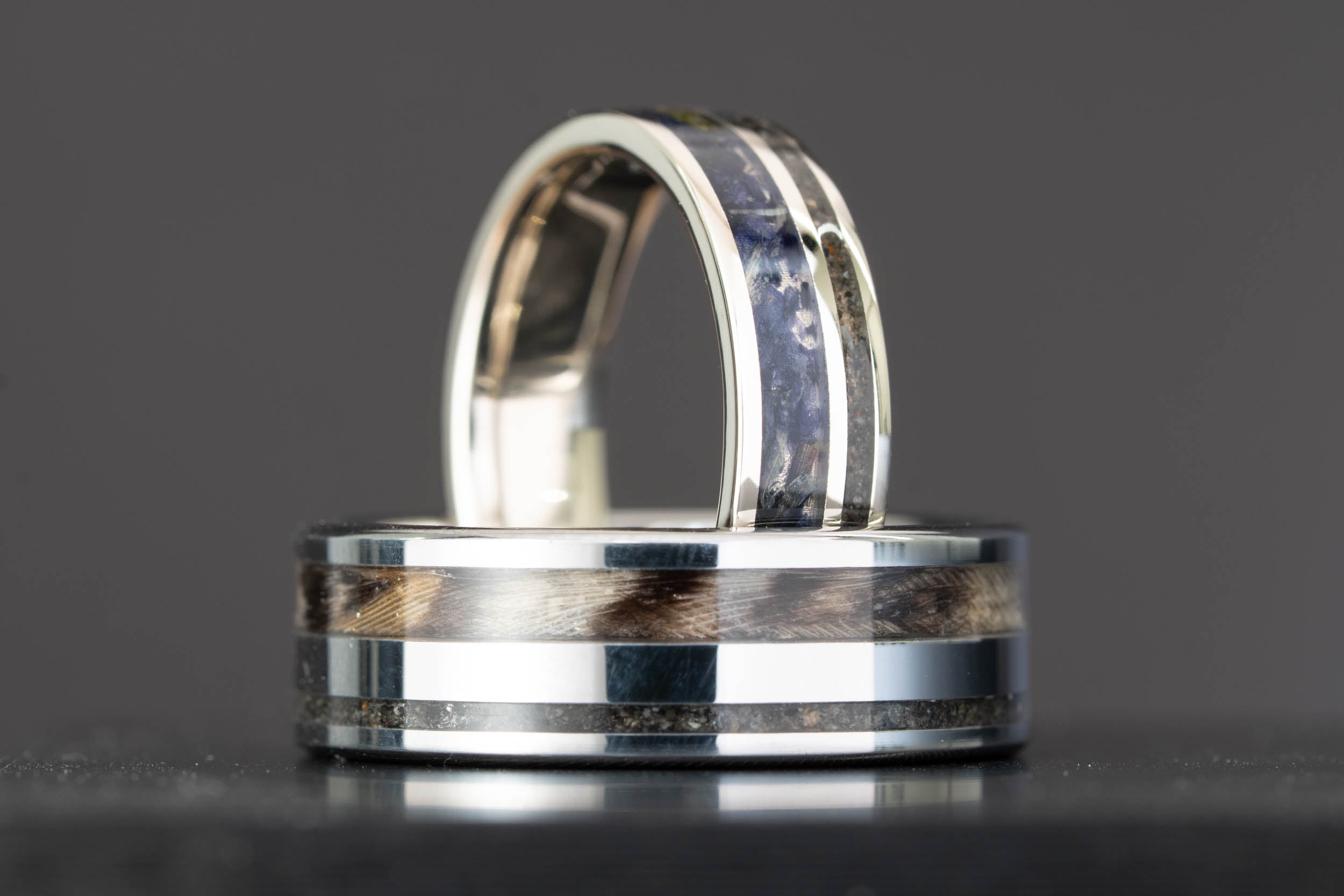 Custom 14k white gold and tungsten engagement ring set with lupine petal, owl feather, and glacier sand inlay, handcrafted by Honest Hands Ring Co.